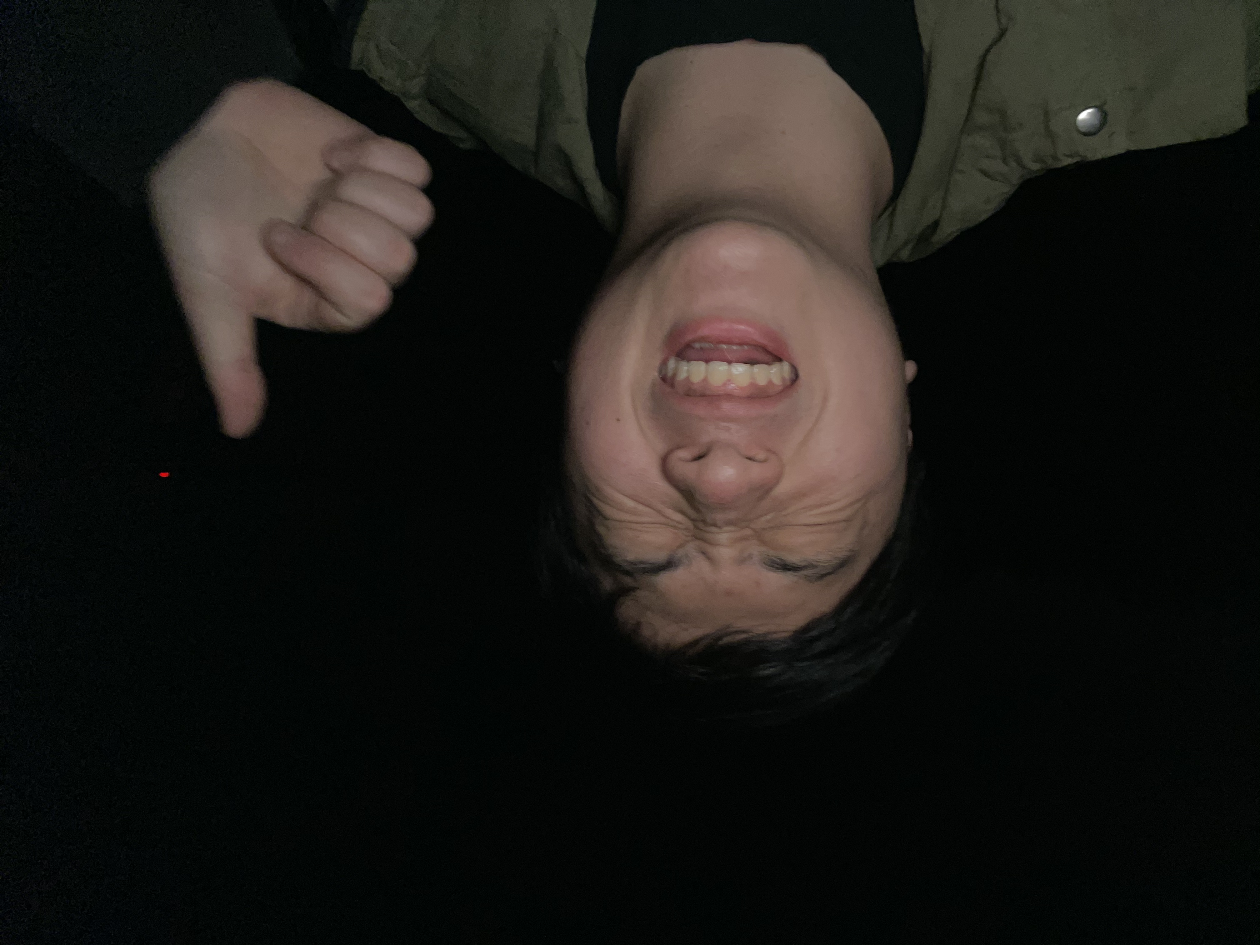 Yasushi laughing with a thumbs up